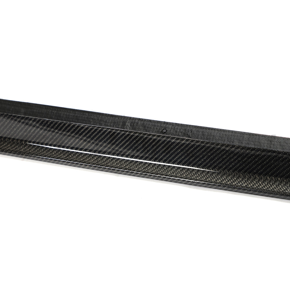 Carbon fibre side skirts for VW Golf MK8/MK8.5 R 2020+ by CT Carbon, showing sleek aerodynamic design on the vehicle side.
