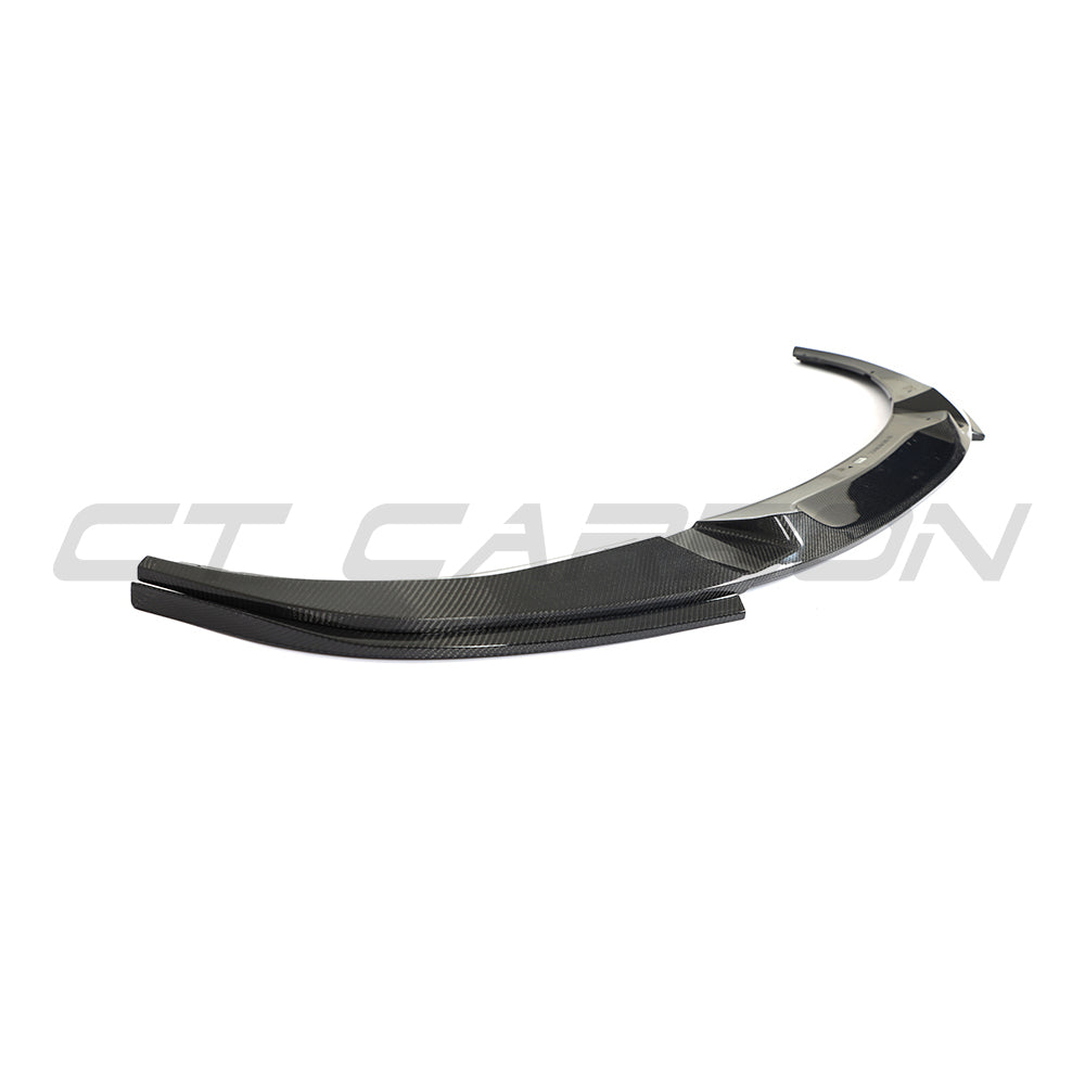BMW 4 Series G26 and i4 carbon fibre splitter V2 by CT Carbon, showcasing sleek aerodynamic design and detailed carbon fiber texture.