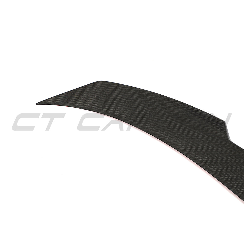 BMW G87 M2 or G42 2 Series carbon fibre spoiler by CT Carbon, shown on a sleek sports car with aerodynamic design details.