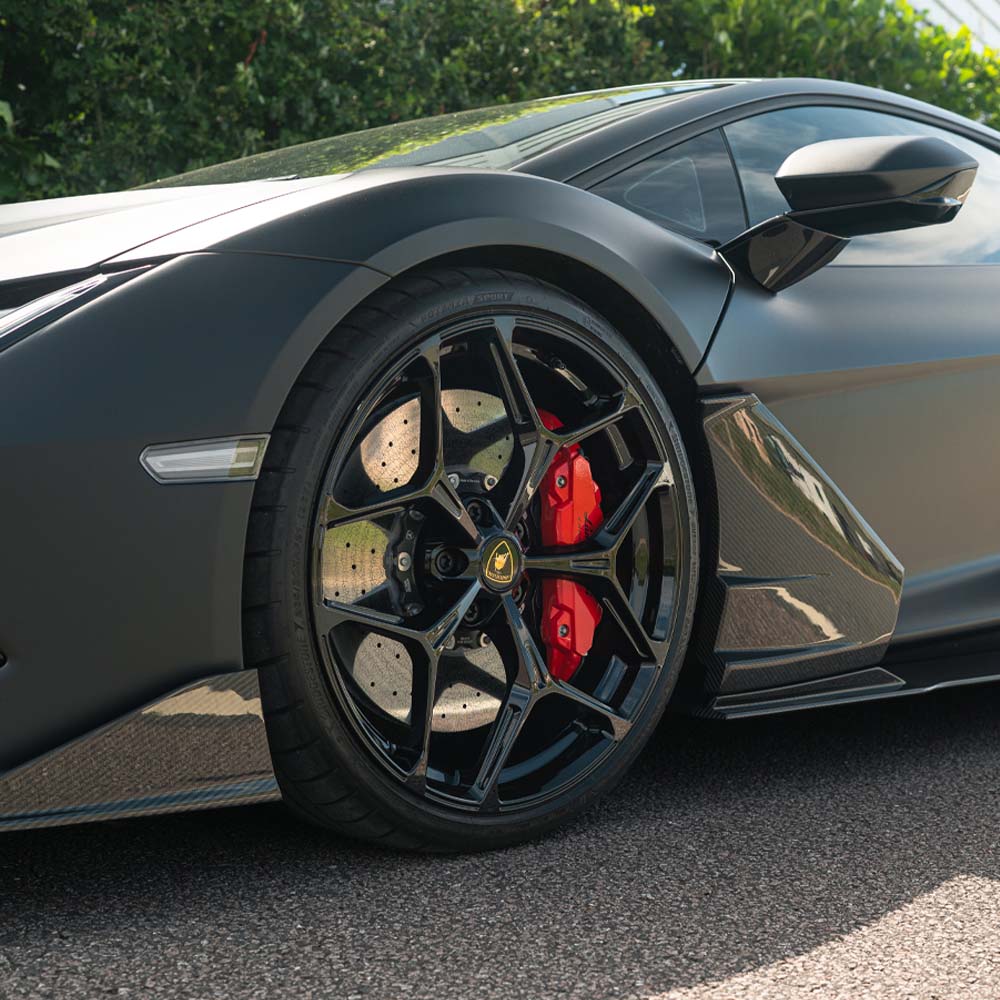 Lamborghini Revueltto full carbon fiber kit by CT Carbon, showing detailed close-up of the sleek carbon fiber components.