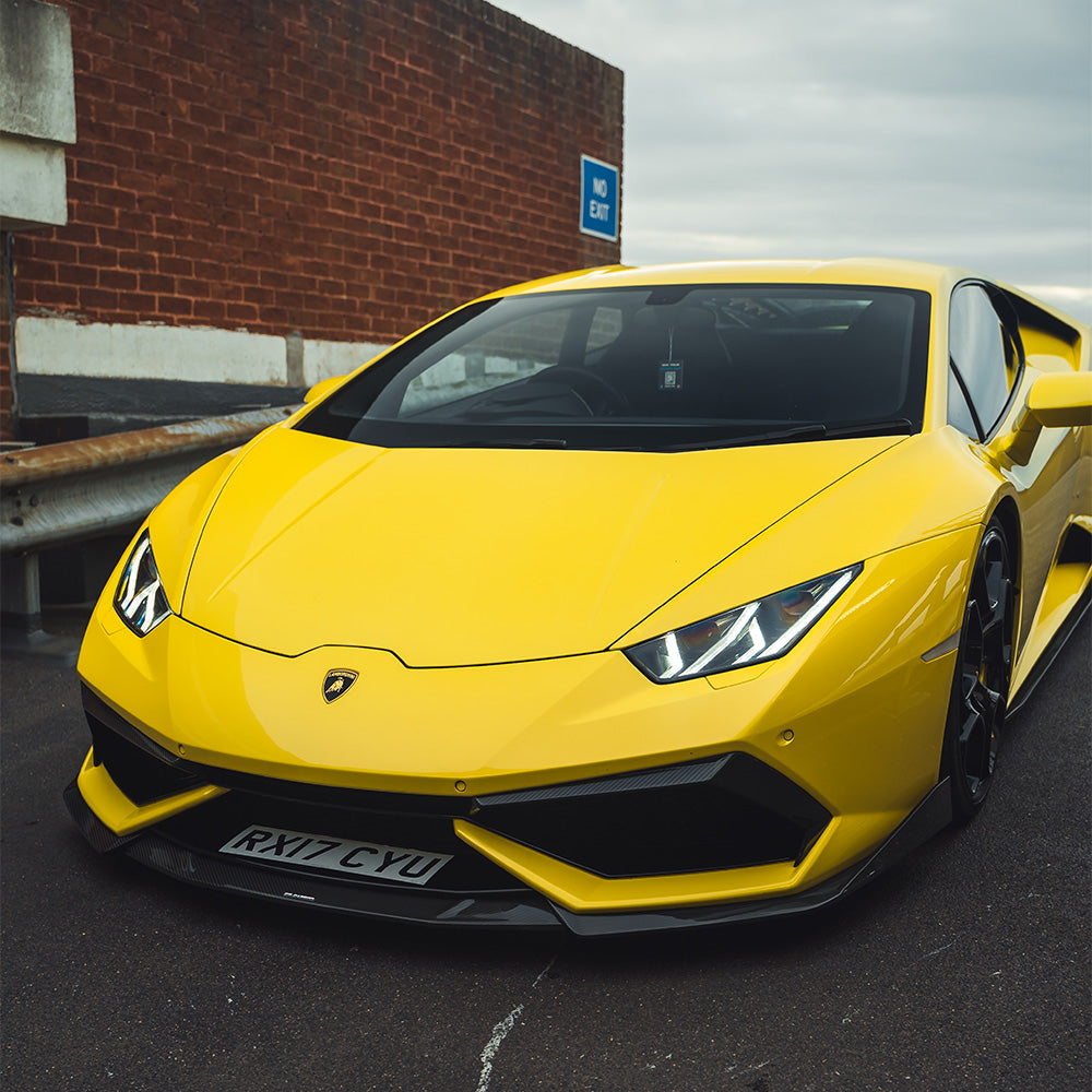 Lamborghini Huracan LP-610 carbon fiber front bumper trim accessory by CT Carbon, showcasing sleek, lightweight design.