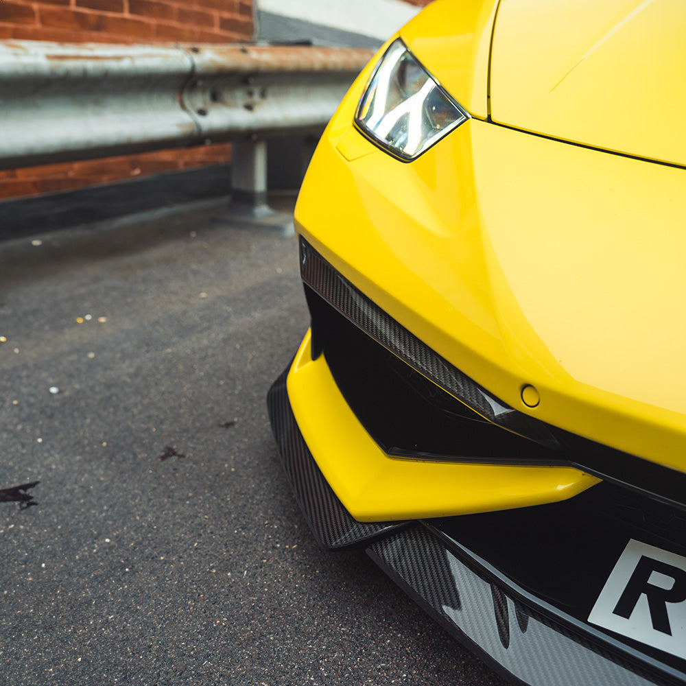 Lamborghini Huracan LP-610 carbon fibre front bumper trim accessory by CT Carbon, showcasing sleek automotive design details.