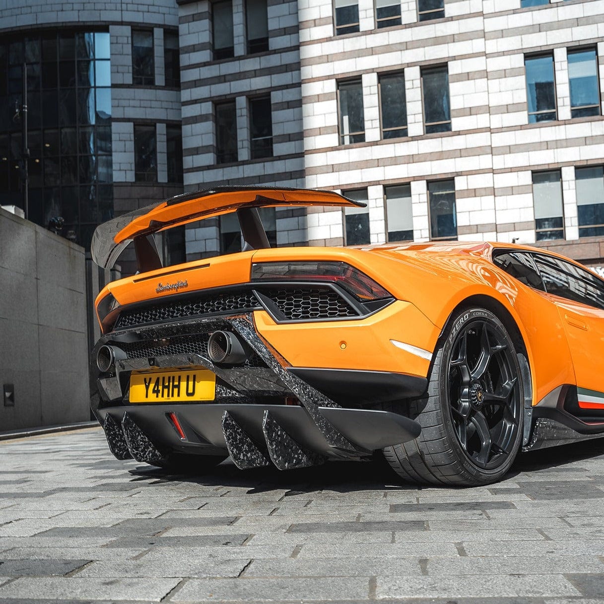 Lamborghini Huracan Performante diffuser extensions by CT Design, showcasing carbon fiber details on the vehicle's rear diffuser.