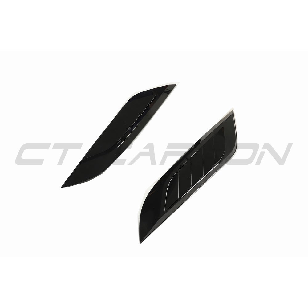 Gloss black Land Rover Defender L663 hood trim accessory by CT Carbon, shown on the vehicle’s front hood.