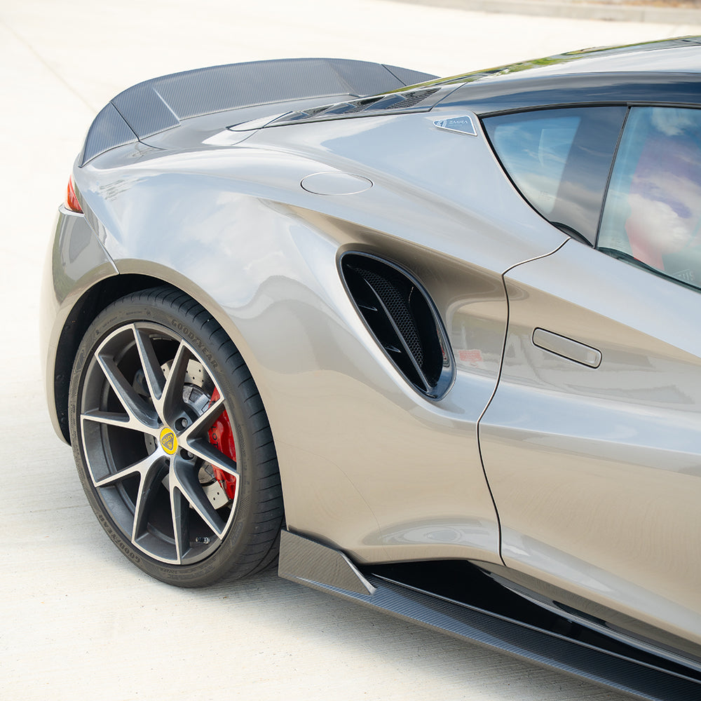 Lotus Emira carbon fiber side skirts by CT Design, showcasing sleek, lightweight aerodynamic enhancements for the sports car.