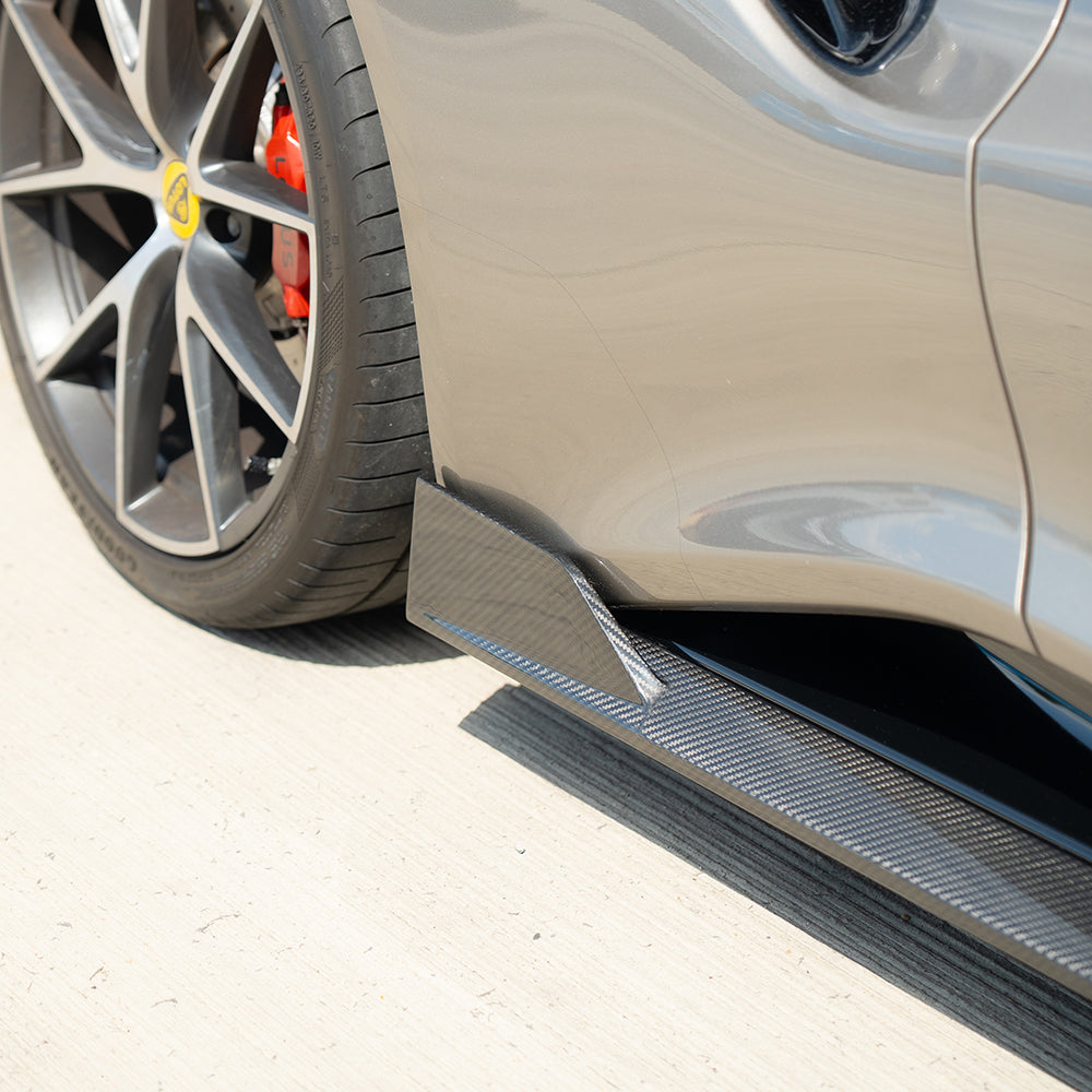 Lotus Emira carbon fibre side skirts by CT Design, sleek aerodynamic car accessories with a textured finish.