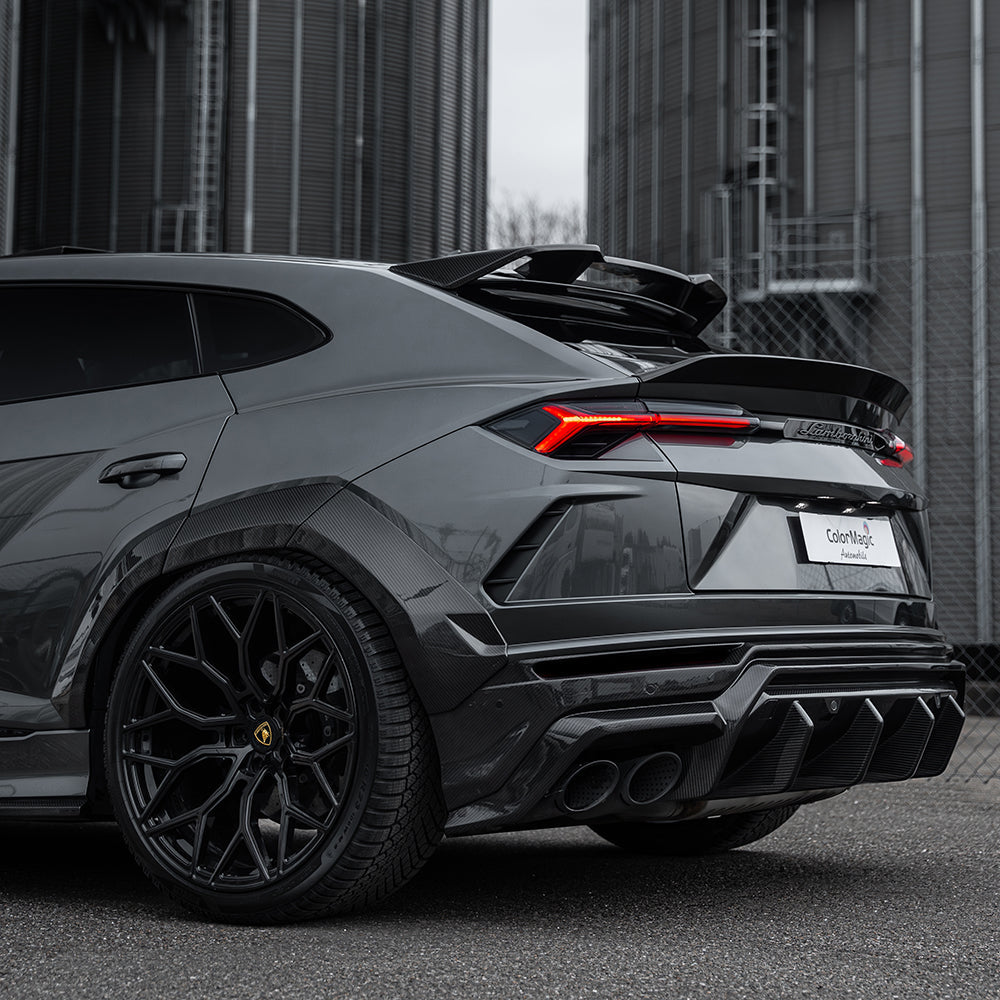 Lamborghini Urus carbon fibre roof spoiler by CT Carbon, sleek aerodynamic design, mounted on a luxury SUV.