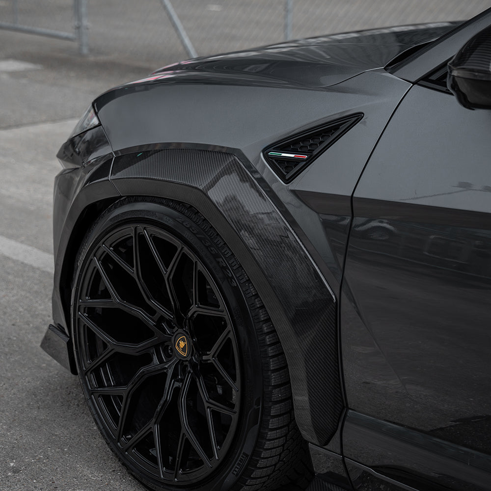 Lamborghini Urus with CT Carbon full carbon fibre arches, showcasing sleek, aerodynamic design on the vehicle's wheel arches.