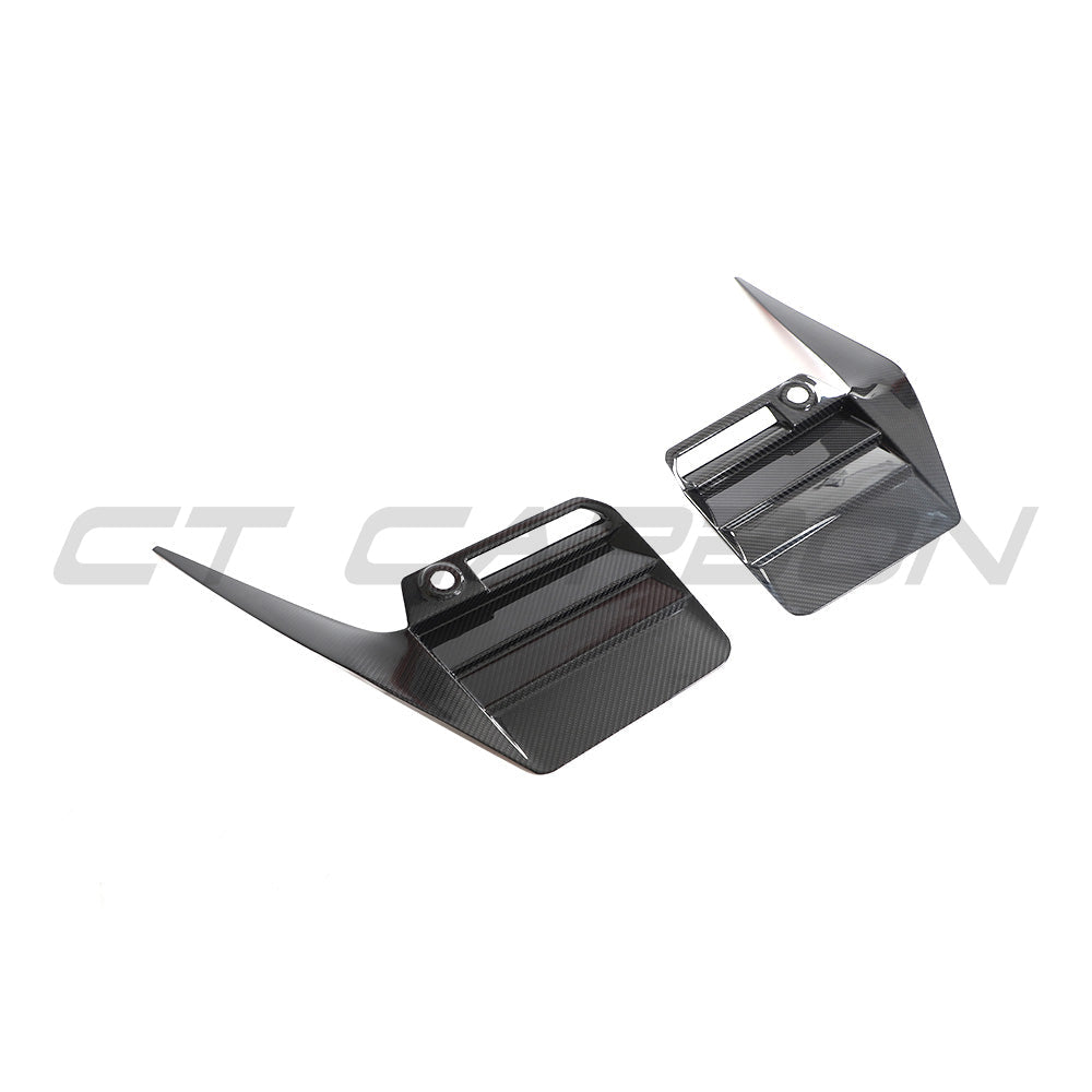 BMW G87 M2 2023 carbon fibre rear bumper trim by CT Carbon, showcasing sleek, glossy black accessory for sporty look.