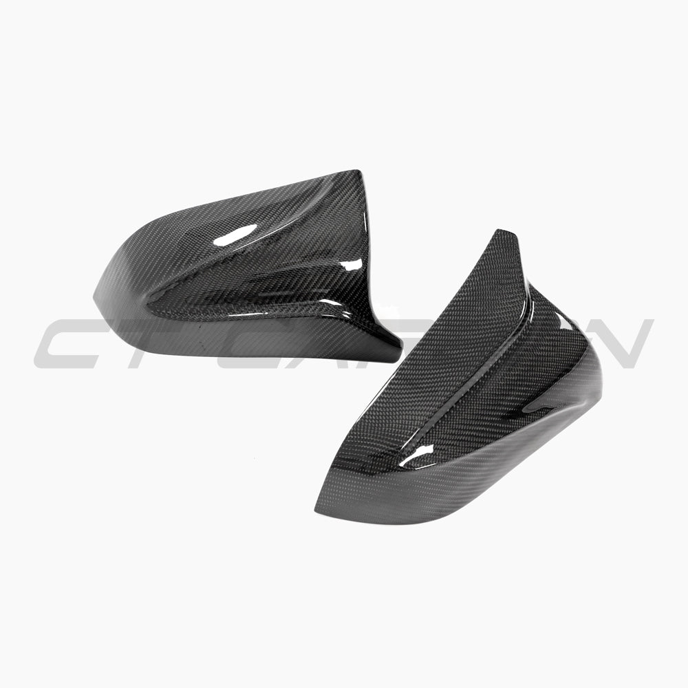 Tesla Model 3 2017+ carbon fiber mirror covers by CT Carbon, V2 accessories, showcasing sleek, textured carbon fiber finish.