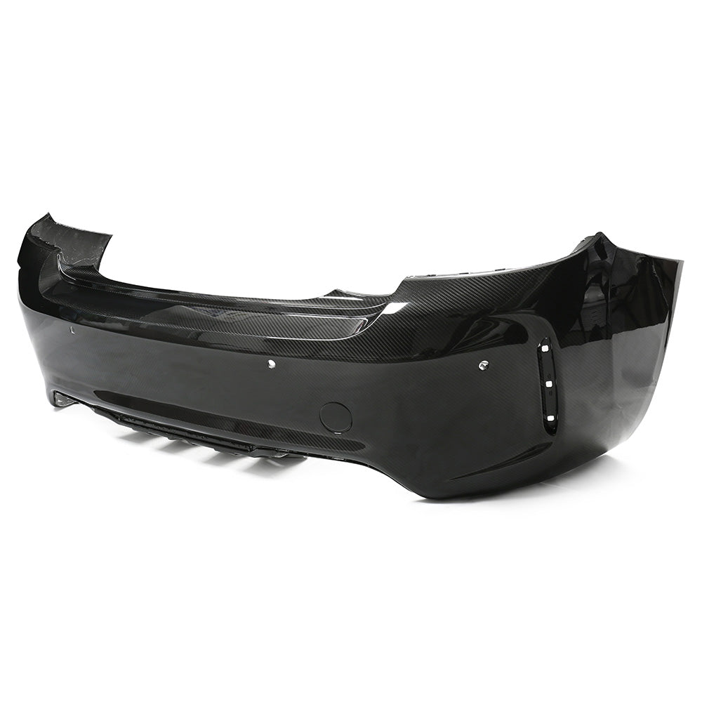 BMW F87 M2 Carbon Pre-Preg Fibre Rear Bumper by CT Carbon, showing detailed view of the lightweight, sporty car bumper.