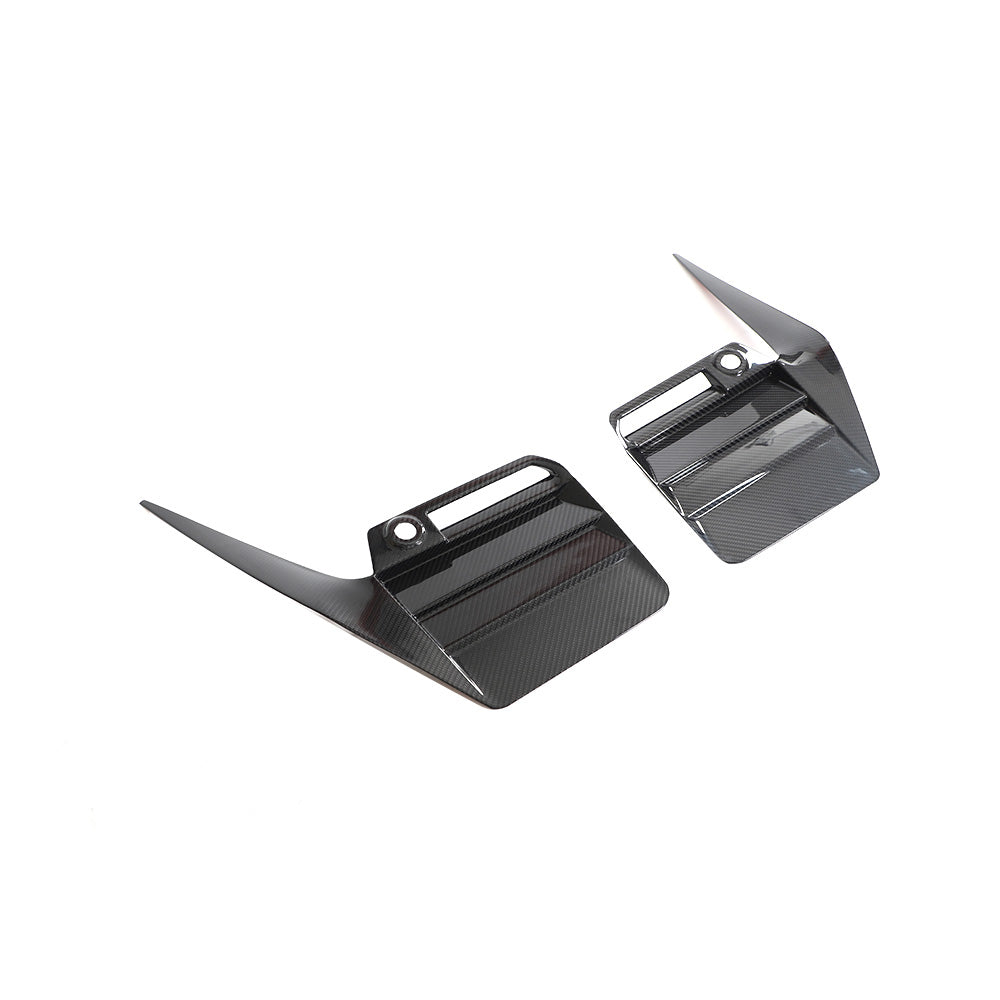 BMW G87 M2 2023 carbon fibre rear bumper trim accessory by CT Carbon, showcasing sleek black finish and textured surface.