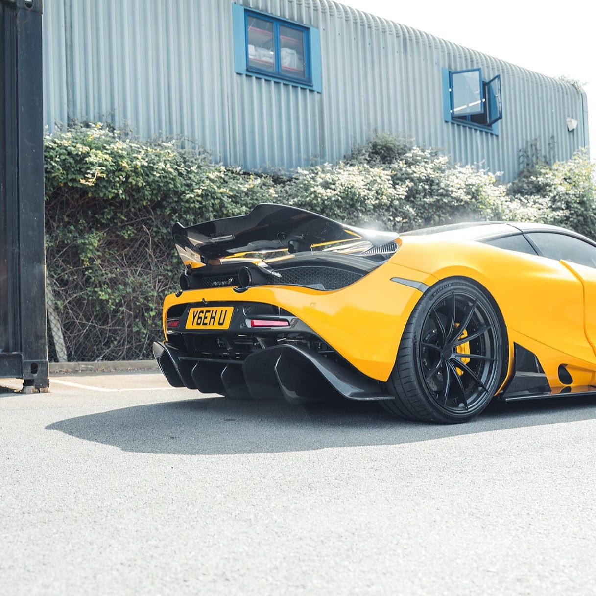 Carbon fiber diffuser for McLaren 720S or 750S by CT Carbon, shown with sleek black carbon fiber surface and aerodynamic design.