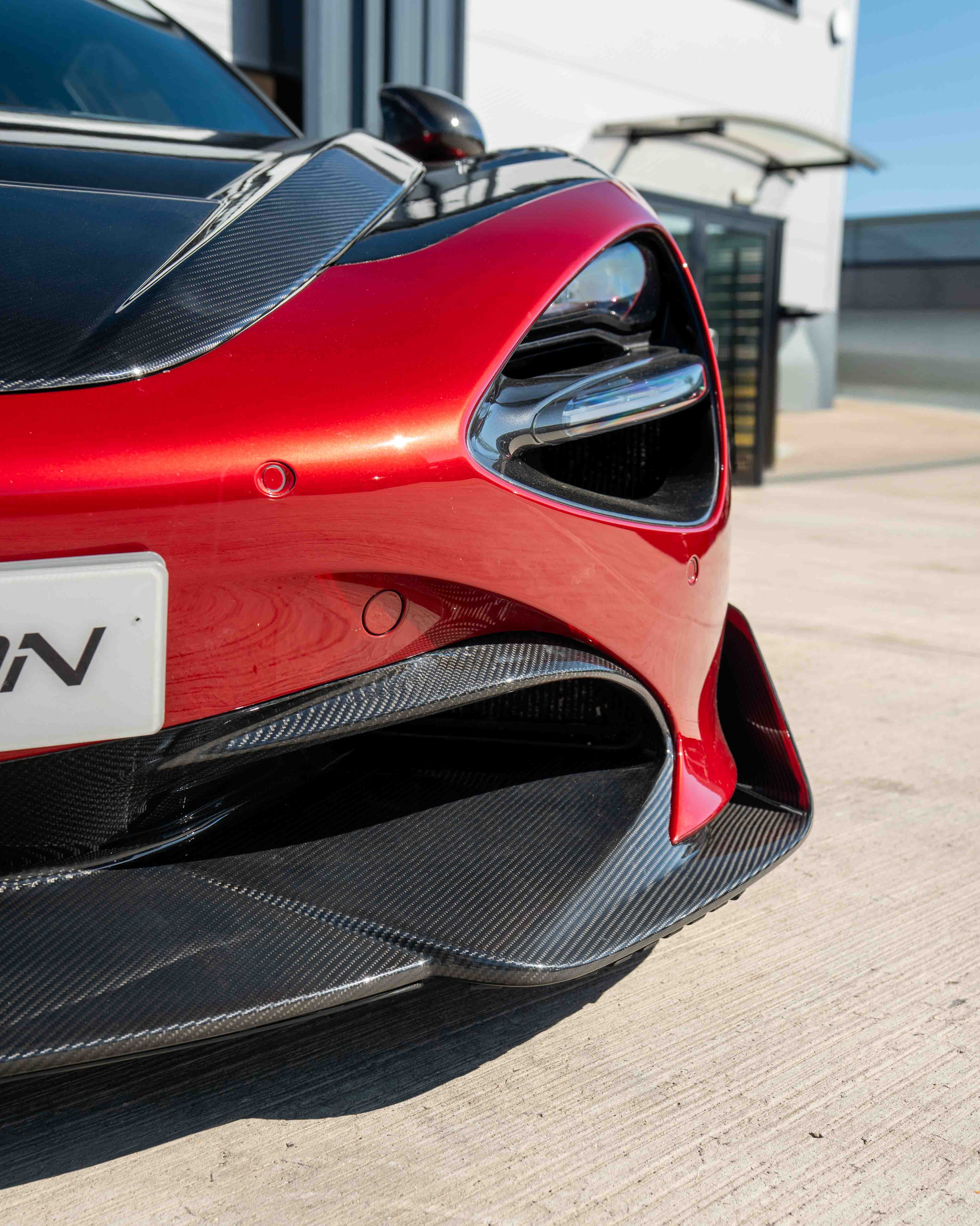 MCLAREN 720S carbon fibre splitter by CT Design V2, showcasing sleek, lightweight aerodynamic component with detailed carbon fiber texture.