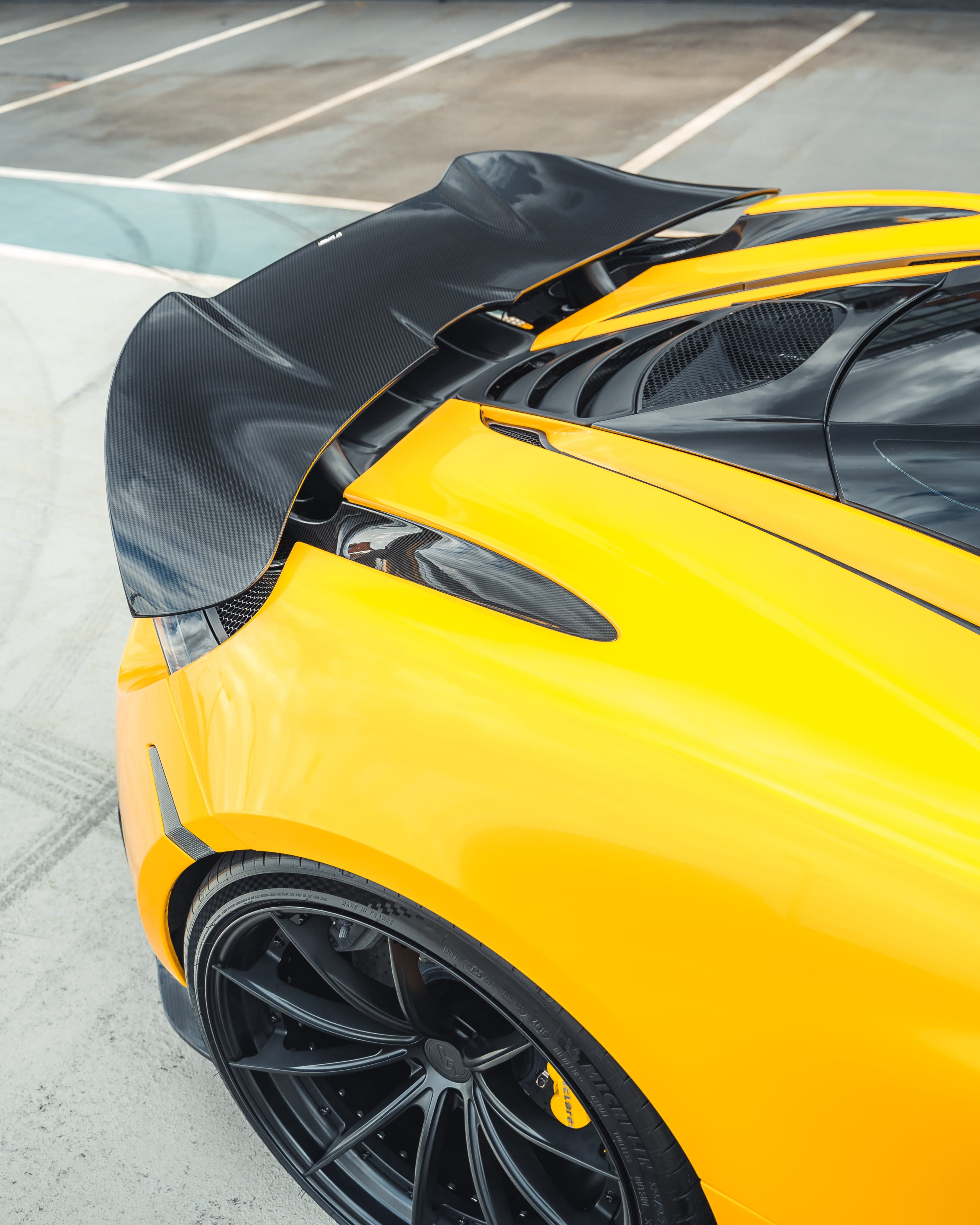 MCLAREN 720S carbon fibre spoiler by CT Design showing sleek aerodynamic design and high-quality carbon fibre material.