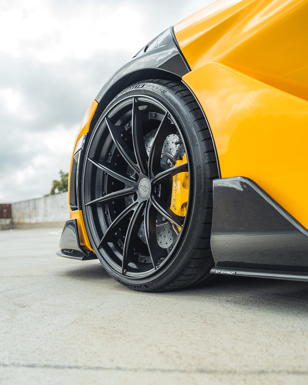 MCLAREN 720S full carbon fiber CT kit showing detailed view of sleek carbon fiber accents on the car's exterior.