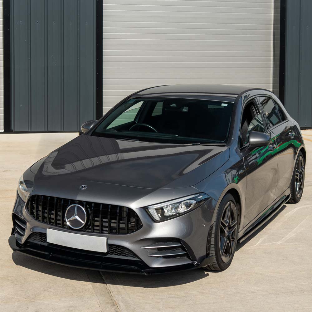 Gloss black side skirts for Mercedes A-Class W177 and V177, made by CT Carbon, shown on a sleek vehicle.