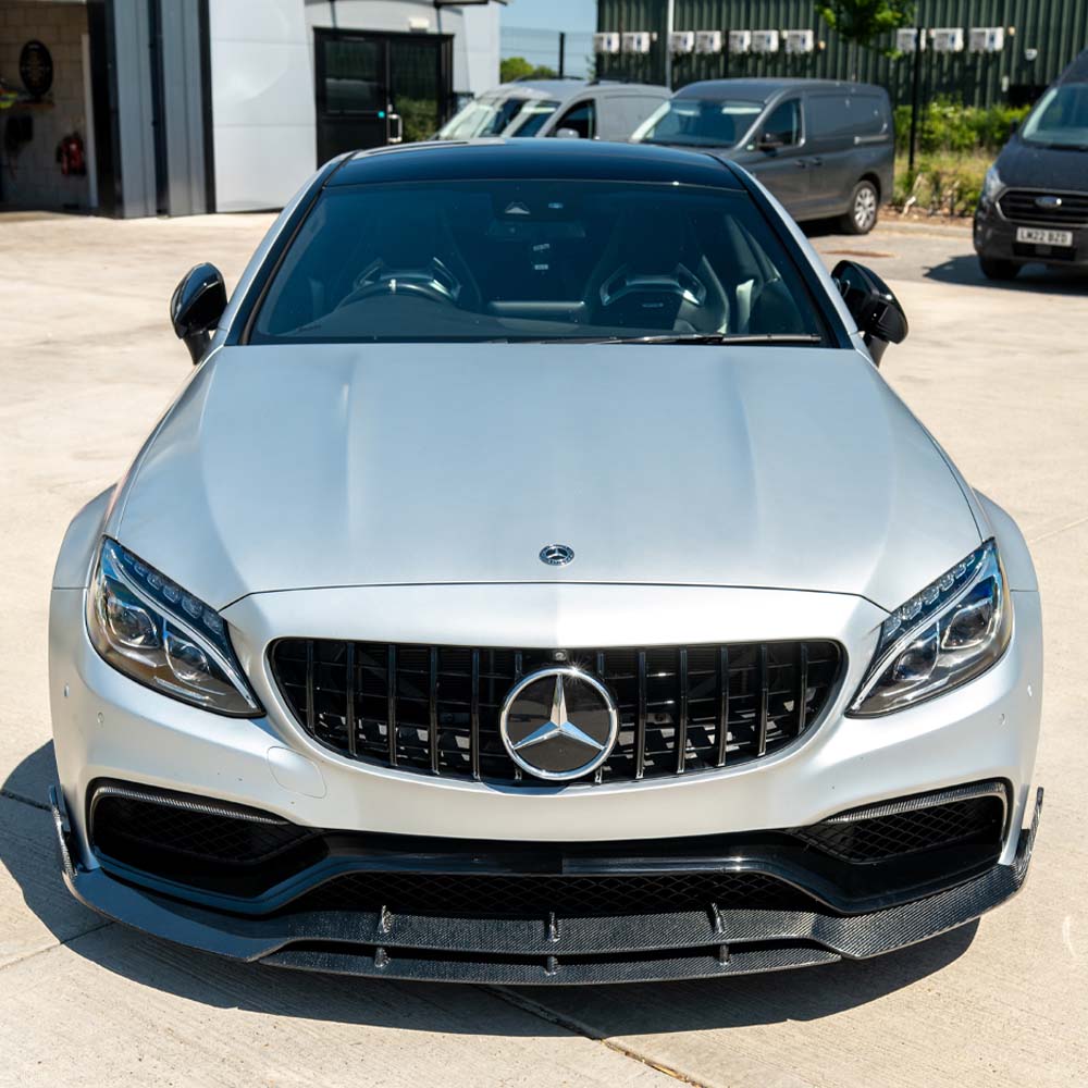 Mercedes C63 W205 coupe carbon fibre splitter by CT Carbon, V2 style, showcasing the sleek front splitter with detailed carbon fiber finish.