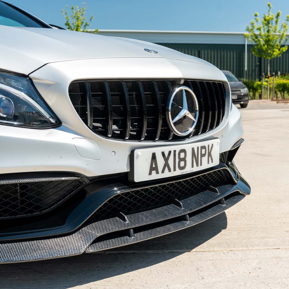 Mercedes C63 W205 coupe carbon fiber splitter V2 by CT Carbon, showing the aerodynamic front splitter with a sleek carbon fiber finish.