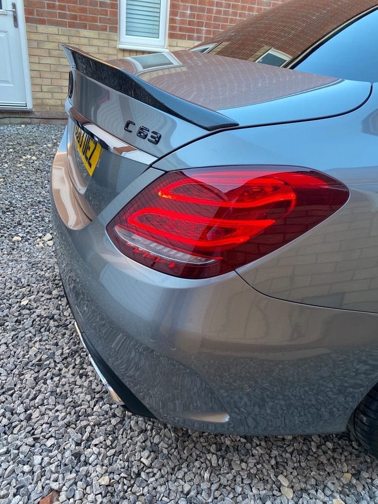 Carbon spoiler for Mercedes C63 and C-Class W205 saloon by CT Carbon, featuring sleek V2 design on a black car.