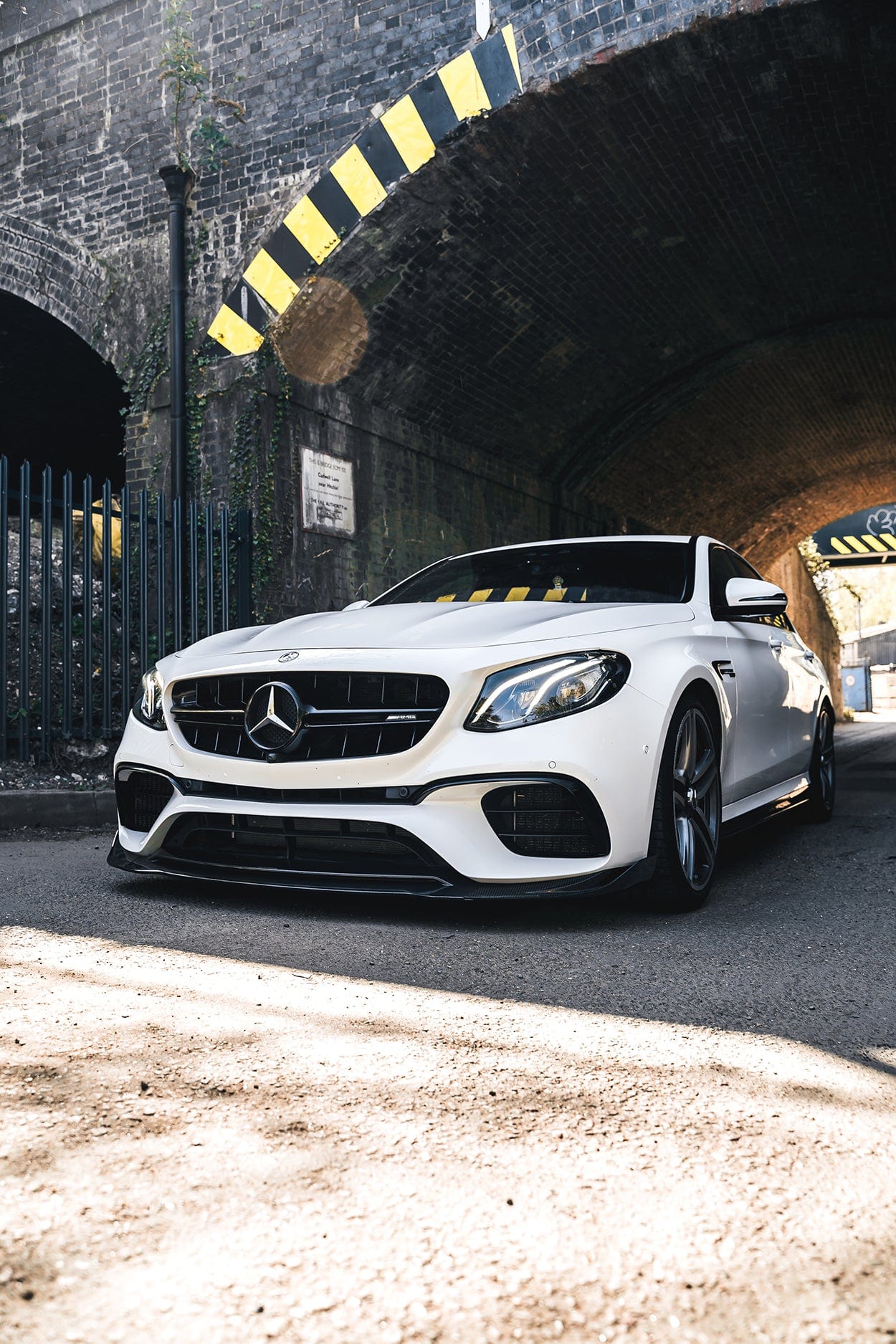Mercedes E63 W213 2018-2020 CT Design carbon fiber splitter installed on front bumper, showcasing sleek, lightweight automotive enhancement.
