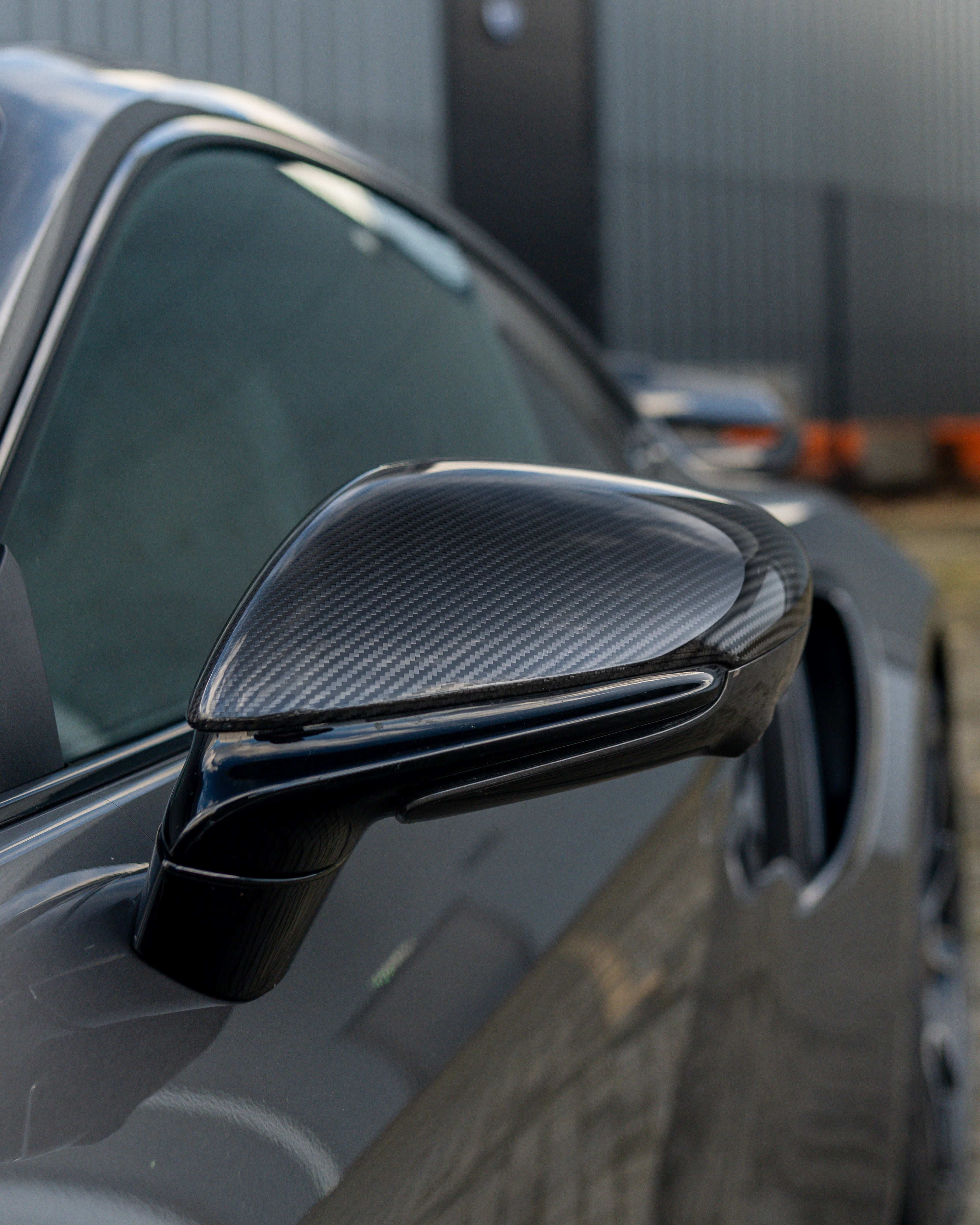 Porsche 911 992 carbon fibre side mirrors by CT Carbon, RHD only, showcasing sleek carbon fibre finish on the accessories.