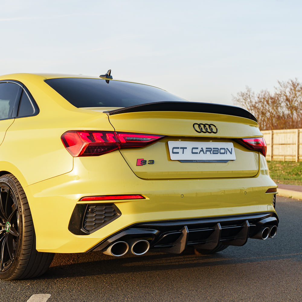 Python yellow Audi S3 saloon with CT Carbon full carbon fibre kit V3, showcasing sleek, lightweight carbon fiber accents on the car.
