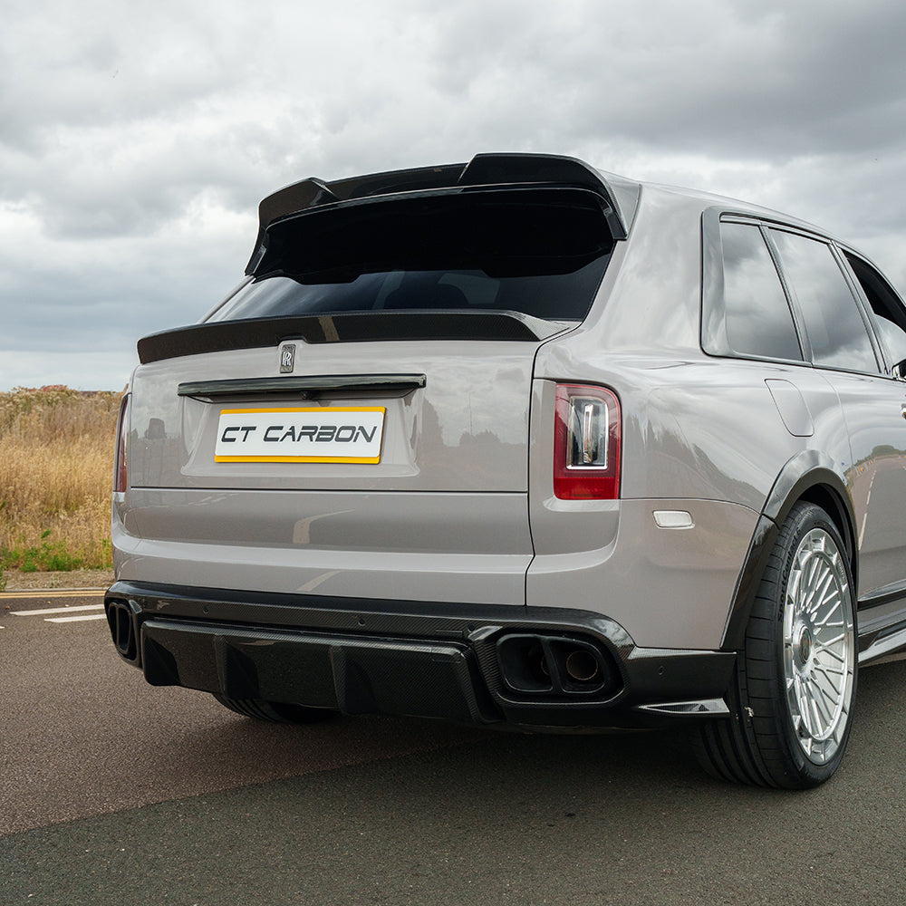 Rolls Royce Cullinan carbon fibre roof spoiler by CT Carbon, showcasing sleek, aerodynamic design on a luxury SUV.