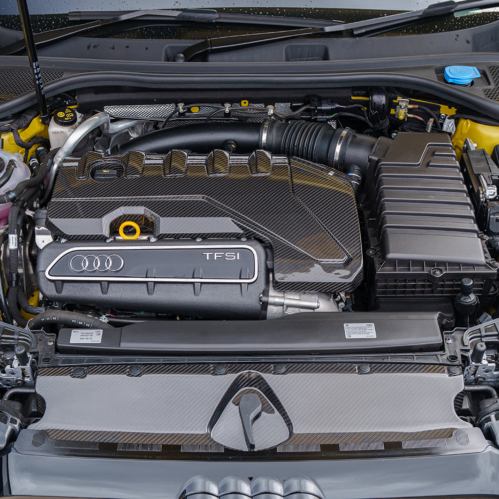 Carbon fiber engine cover for Audi RS3 8Y 2020+ by CT Carbon, showcasing a sleek, high-performance automotive accessory.