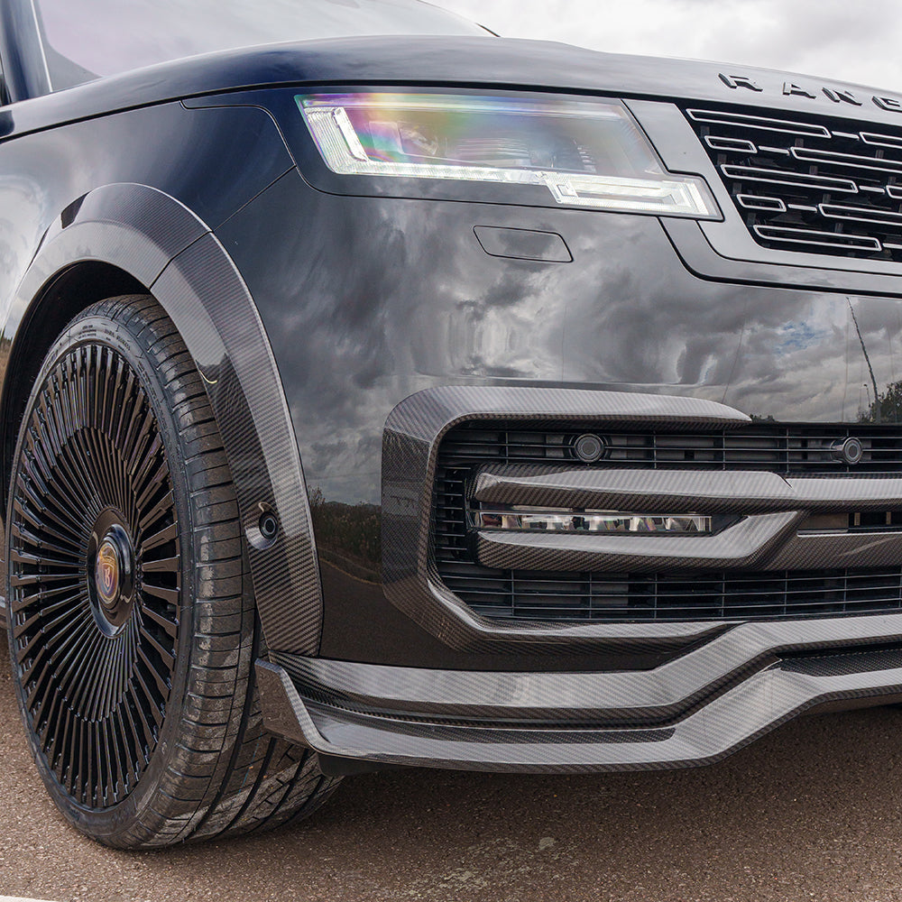 Range Rover L460 2022+ Carbon Fibre Front Bumper Trim by CT Carbon, close-up of sleek, lightweight accessory on vehicle front.