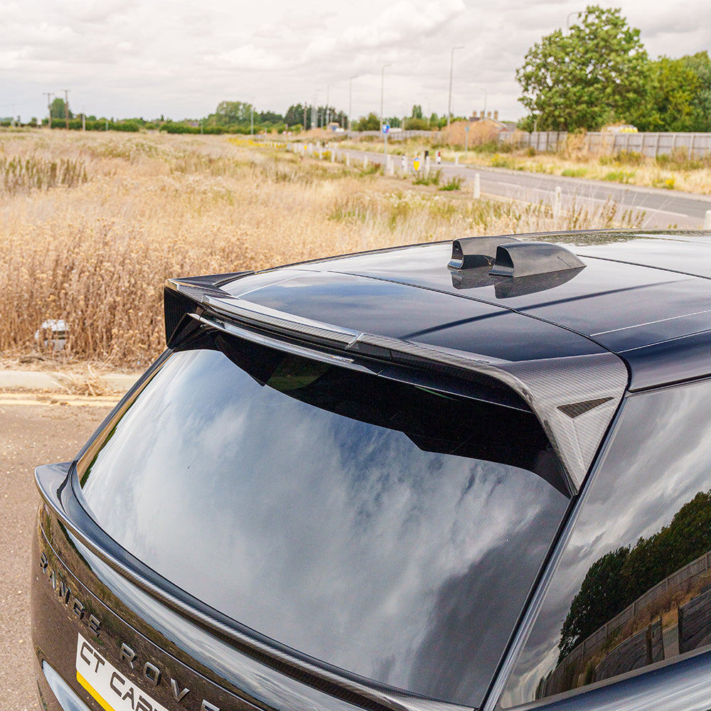 Range Rover L460 2022+ Carbon Fibre Middle Spoiler by CT Carbon, showcasing the sleek, aerodynamic design on the vehicle.