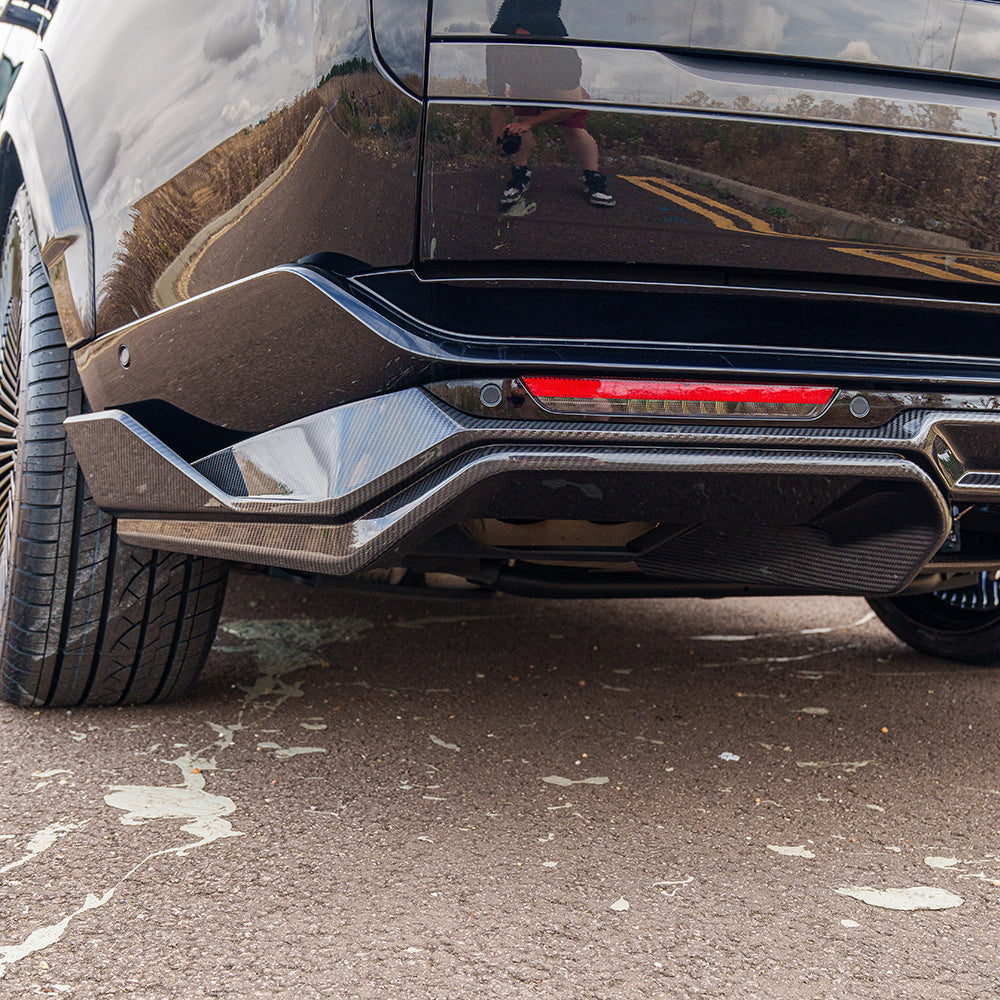 Range Rover L460 2022+ CT Carbon carbon fibre diffuser showing sleek design and detailed finish on a luxury SUV.