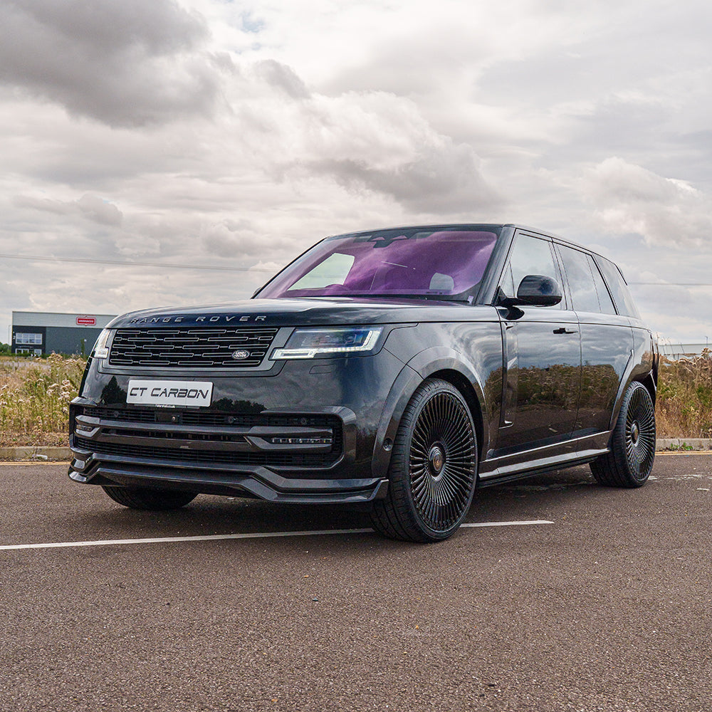 Range Rover L460 2022+ carbon fibre side skirts by CT Carbon, showing sleek, textured exterior detail on a luxury SUV.