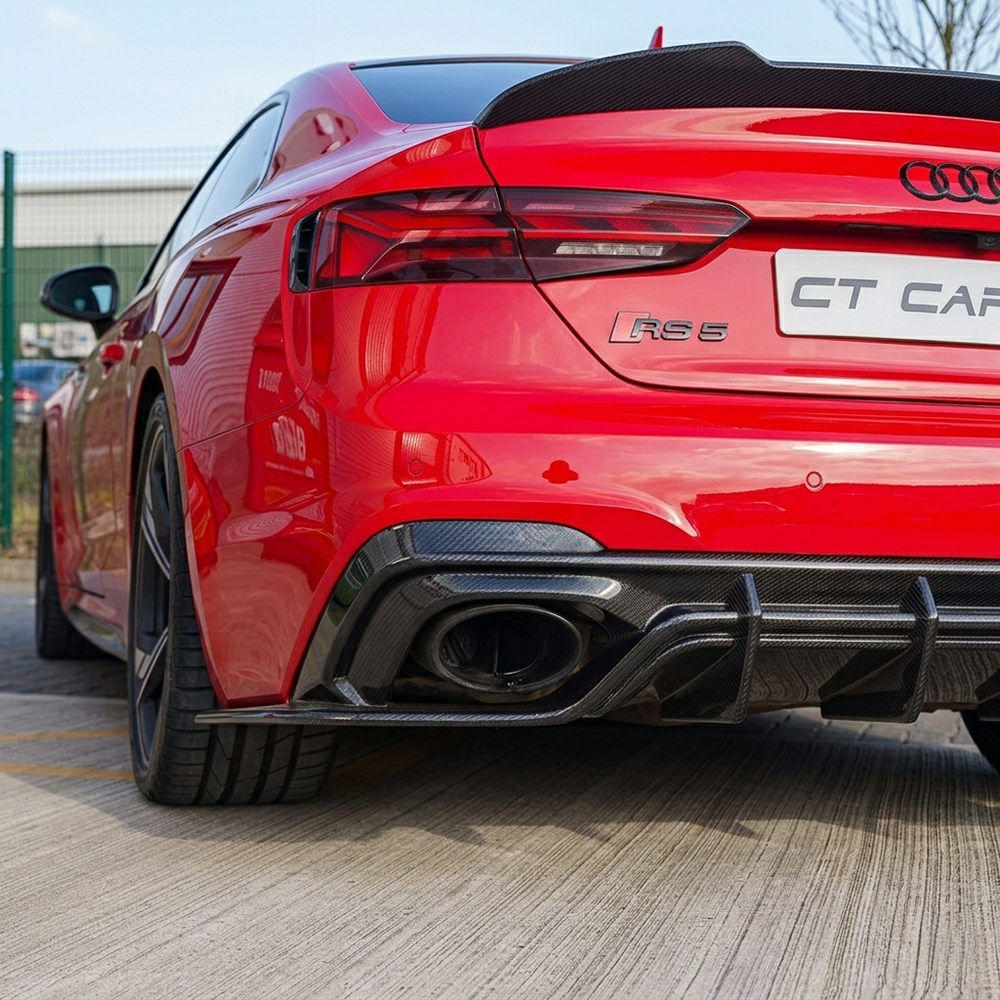 Red Audi RS5 B9.5 Sportback and Coupe carbon fiber diffuser by CT Carbon, showcasing sleek aerodynamic design.
