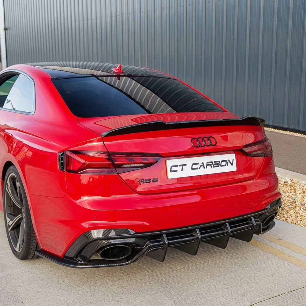 Red carbon fiber diffuser for Audi RS5 B9.5 Sportback and Coupe 2020-2025 by CT Carbon, showcasing sleek aerodynamic design.