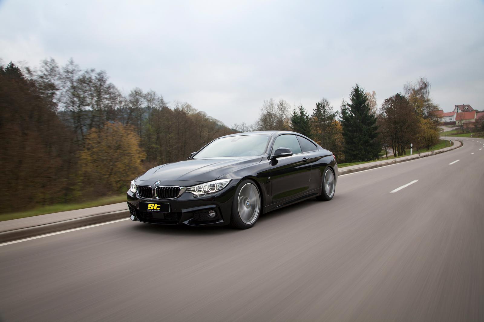 ST Suspension coilovers installed on a BMW 4 Series F32, showing adjustable suspension components and sporty ride setup.