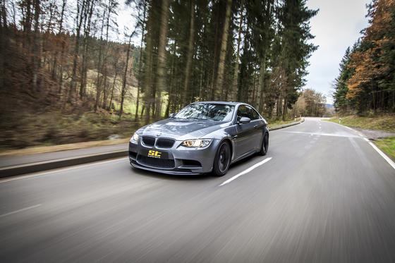 BMW E92 M3 with ST Suspension XTA Plus coilovers featuring adjustable damping and top mounts, shown installed on the vehicle.