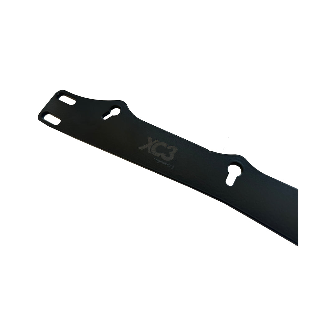 XC3 Engineering under seat harness bracket for BMW E9X F8X G8X models, showing the safety harness attachment point inside the vehicle.