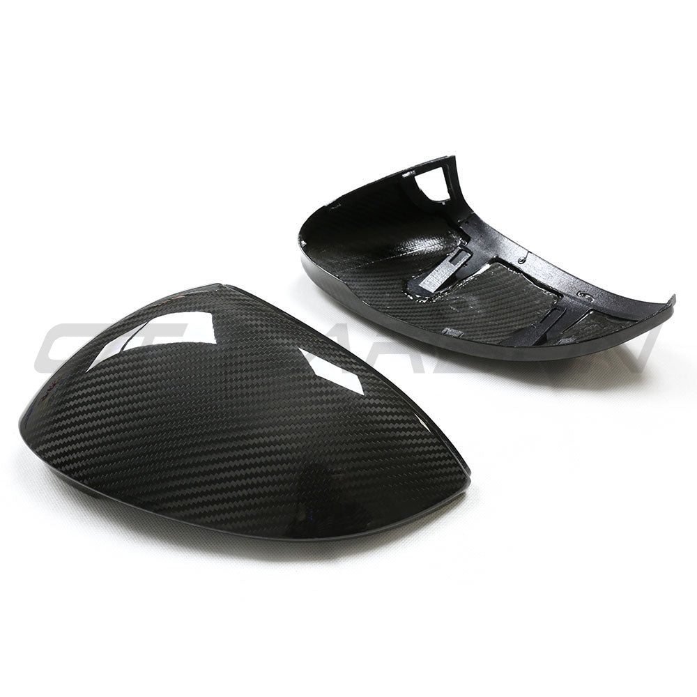 Volkswagen Golf MK8 carbon fibre mirrors with lane assist from CT Carbon, showing sleek side view and integrated lane assist sensors.