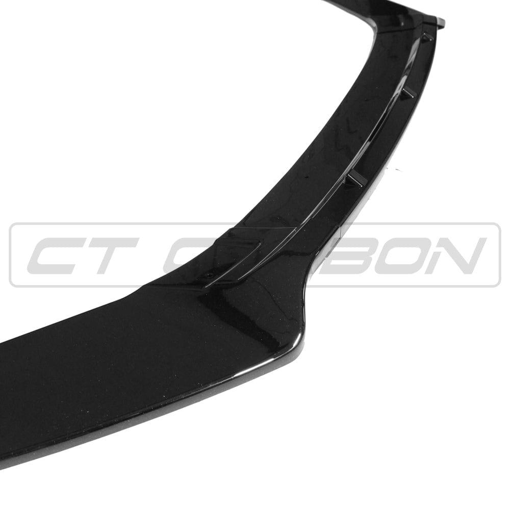Gloss black splitter for Volkswagen Golf R, GTD, GTI MK7/7.5 2014-2020 by CT Carbon, shown on a sporty hatchback.