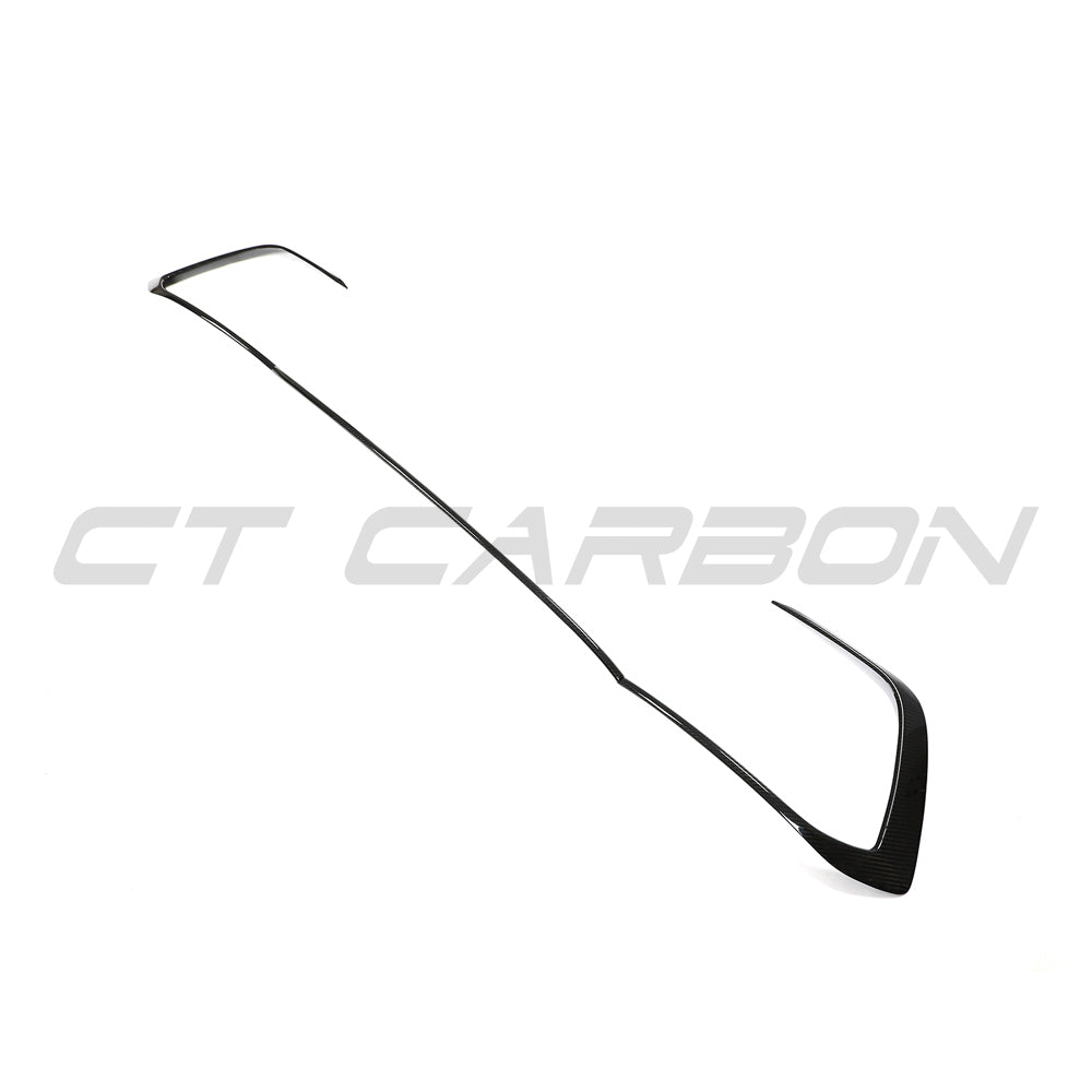 VW Golf MK8 GTI carbon fibre front trim accessory by CT Carbon, showing close-up of sleek, textured carbon fiber detail on the front trim.