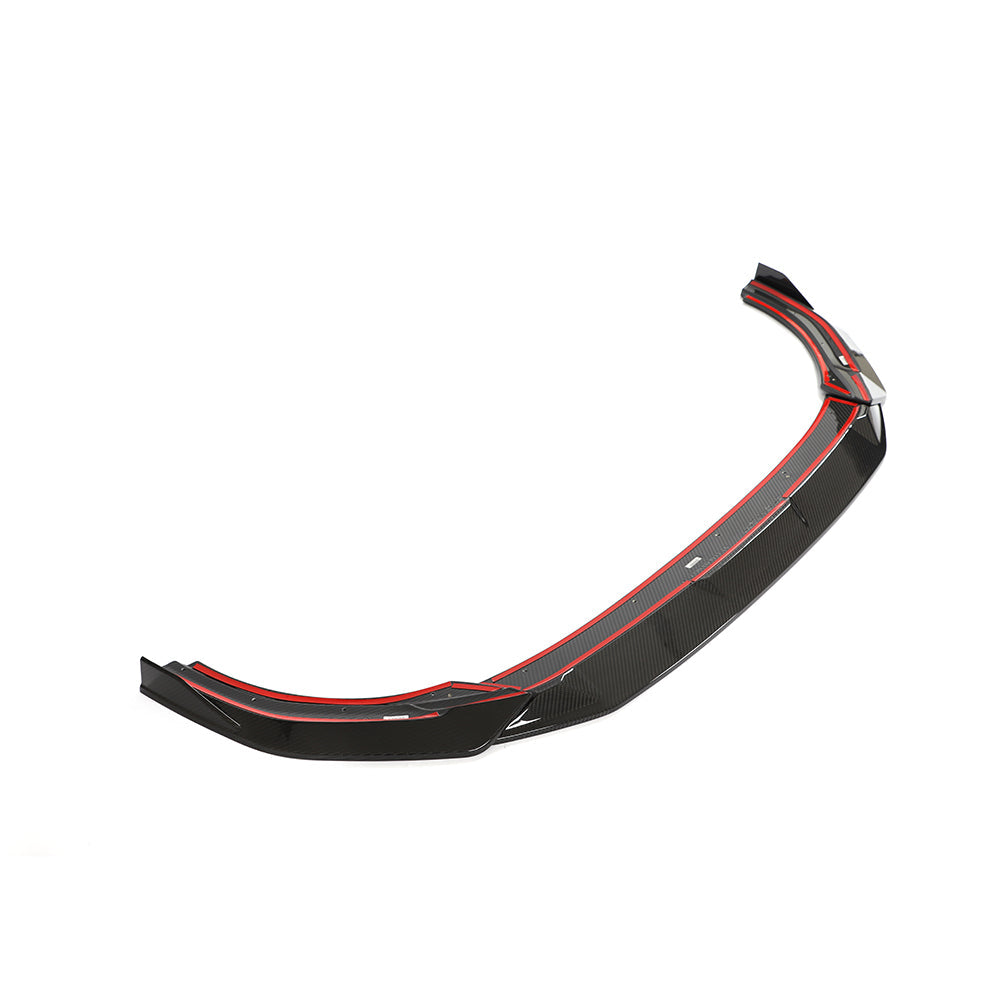 VW Golf MK8 R carbon fiber splitter by CT Design, showing the sleek, textured carbon fiber surface and aerodynamic front design.