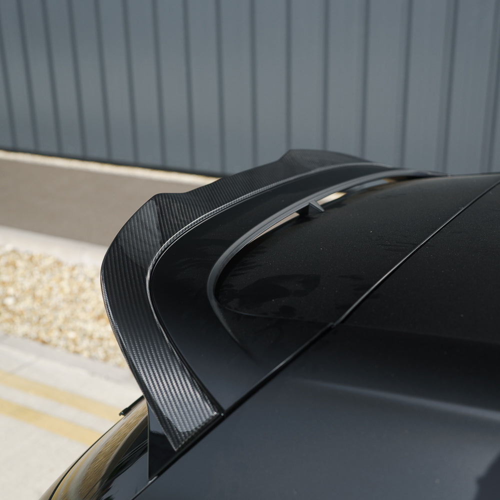 VW Golf MK8 CS carbon fibre spoiler by CT Carbon, satin black finish, sleek aerodynamic design for sporty appearance.