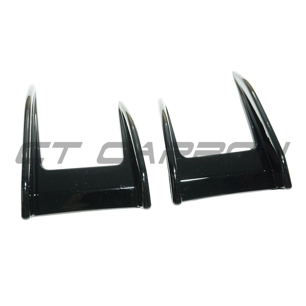 BMW F40 1 Series 2019-2024 CT Carbon gloss black front canards installed on the vehicle, showcasing aerodynamic car accessories.