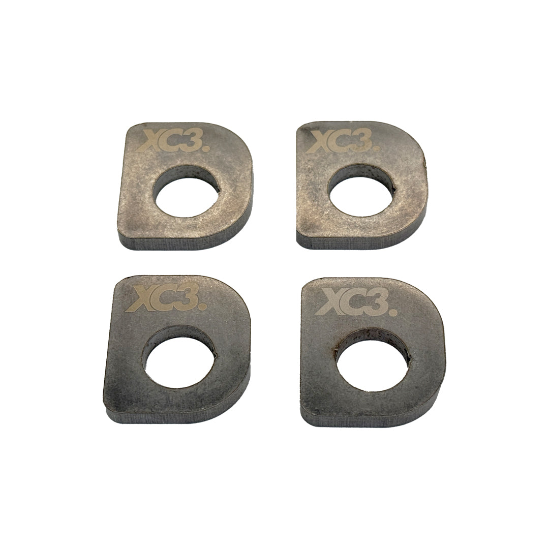 BMW M2, M3, M4 F8X G8X rear toe lockout shims for suspension alignment, shown with shim kit components.