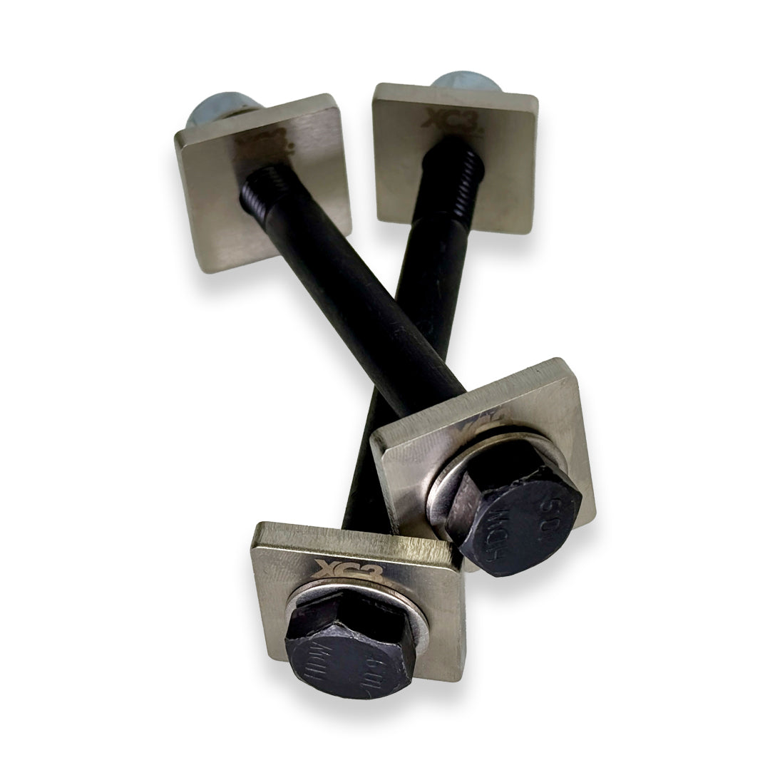 BMW M3 E9X E92 rear toe lockout shim kit by XC3 Engineering for suspension and alignment adjustments, shown in the image.