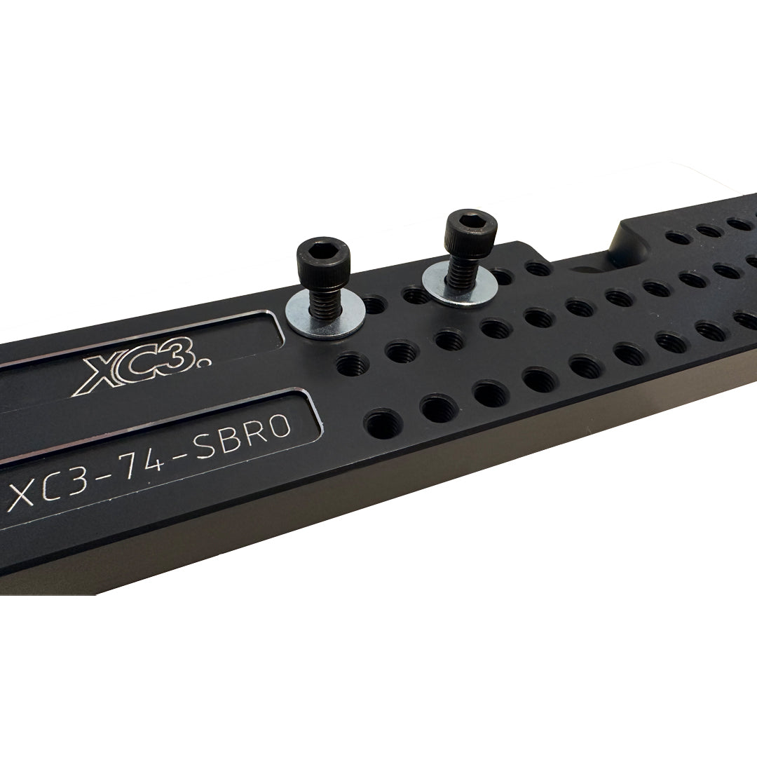 Universal seat base mount adapter for BMW M3 E9X/E92 by XC3 Engineering, showing the sturdy seat bracket and mounting hardware.