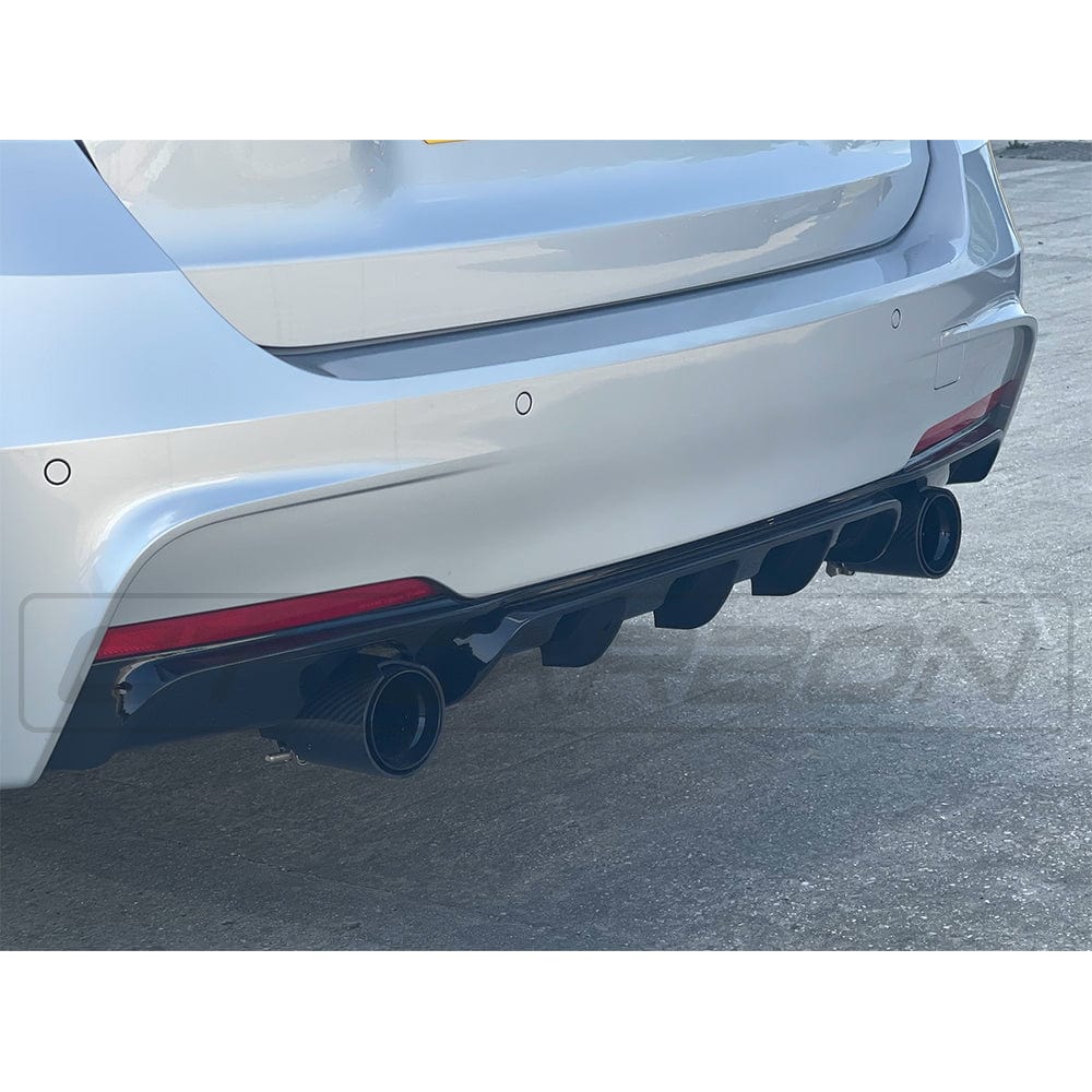 BMW 3 Series F30 dual exhaust diffuser in gloss black by CT Carbon, showcasing a sleek MP style design for enhanced rear aesthetics.