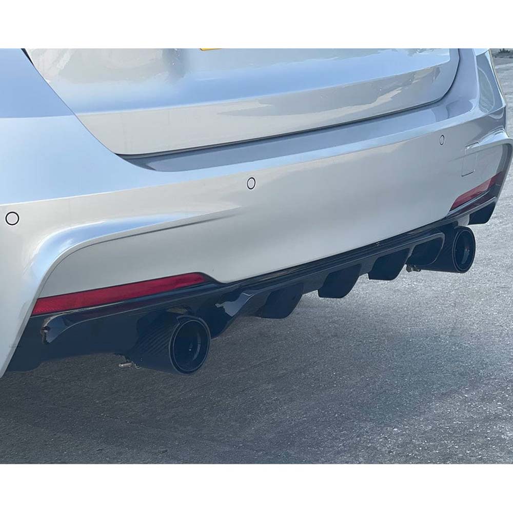 BMW 3 Series F30 gloss black full kit with dual exhaust by CT Carbon, featuring sleek black finish and MP style design.