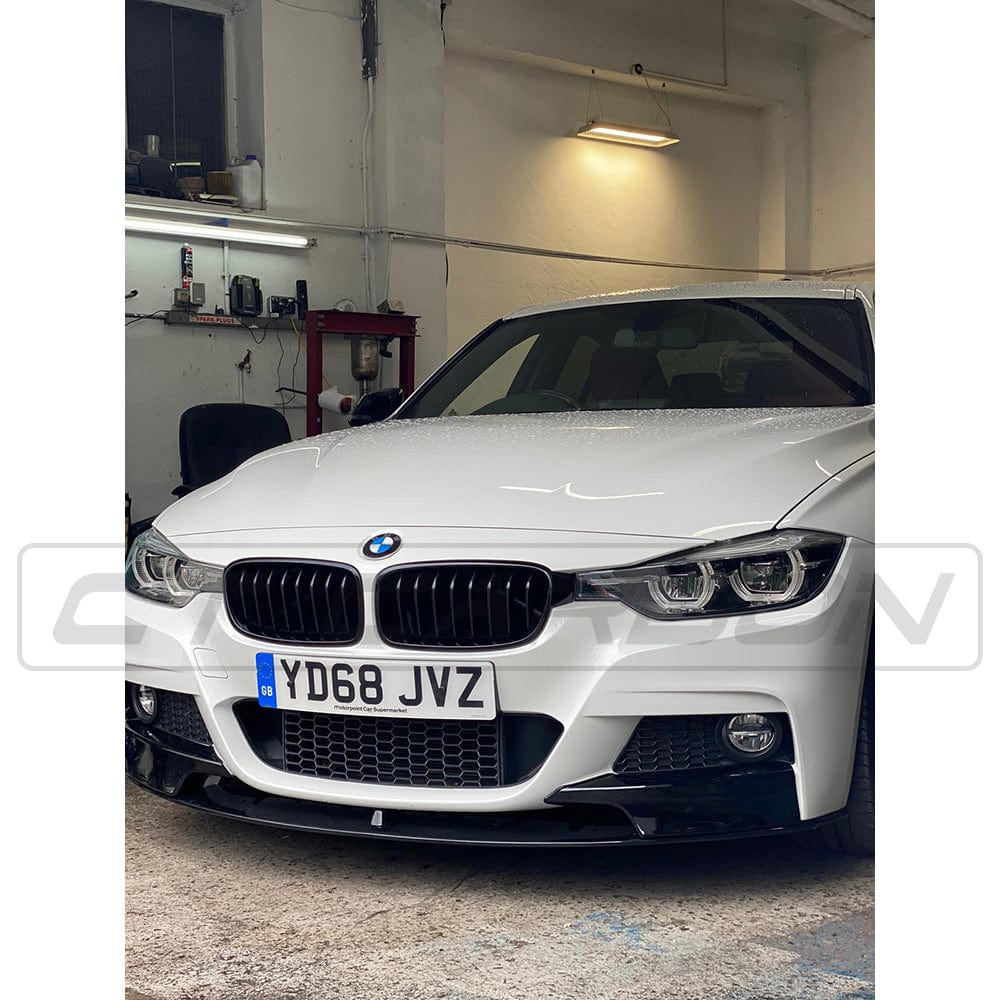 BMW 3 Series F30 CT Carbon gloss black full kit with twin exhaust outlets, showcasing the sleek exterior design and MP style exhaust tips.